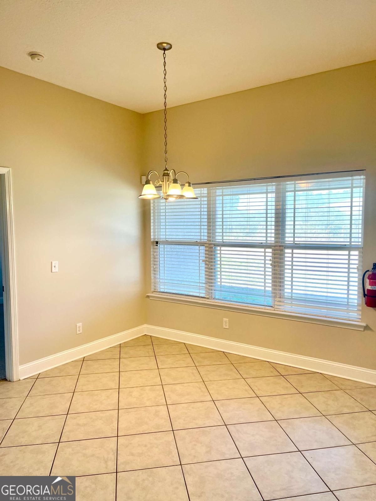 17 Fox Path St. Marys, GA 31558 - Photo 5 of 19 a view of an empty room with a window