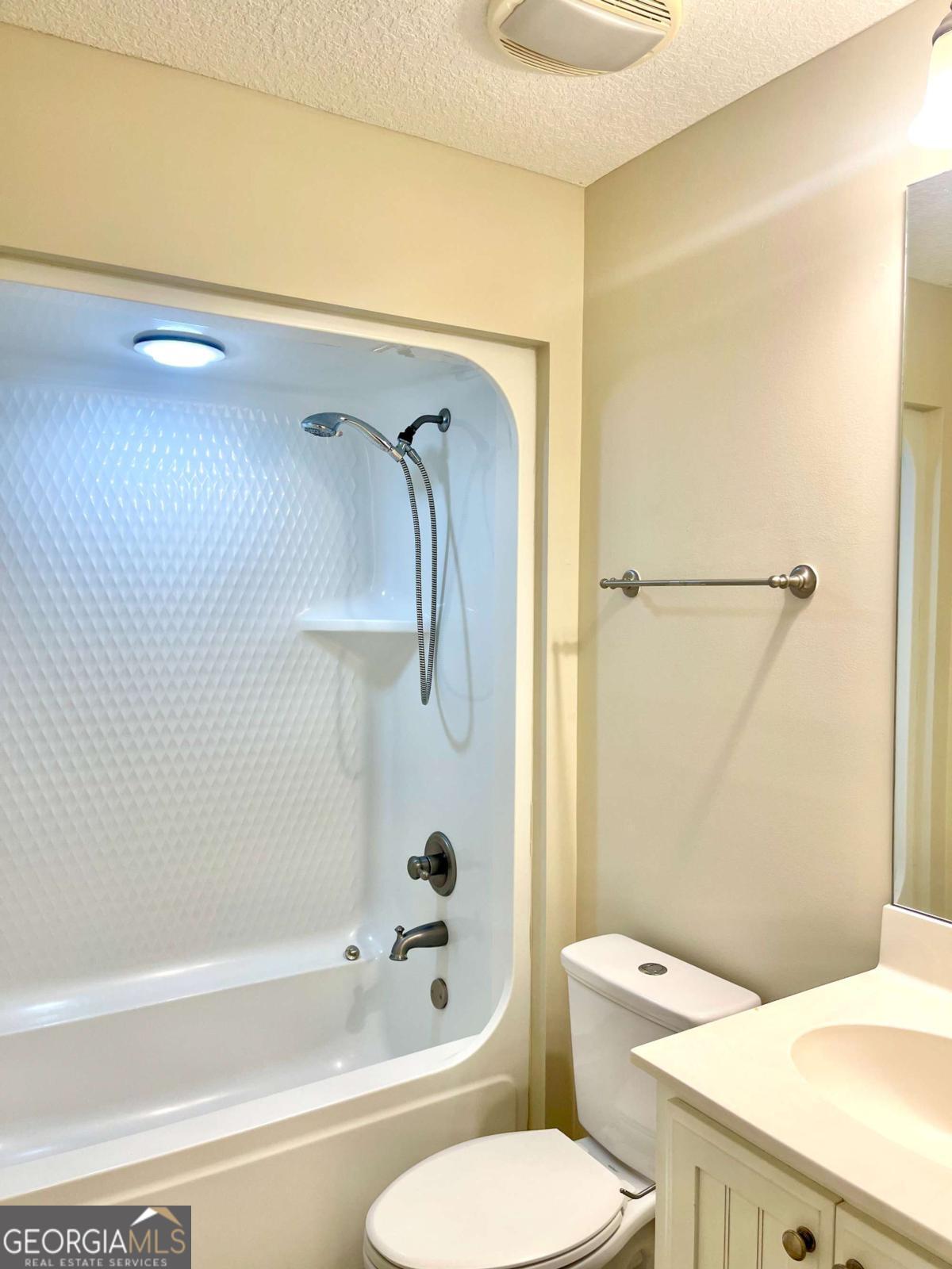 17 Fox Path St. Marys, GA 31558 - Photo 10 of 19 a bathroom with a sink a toilet and shower