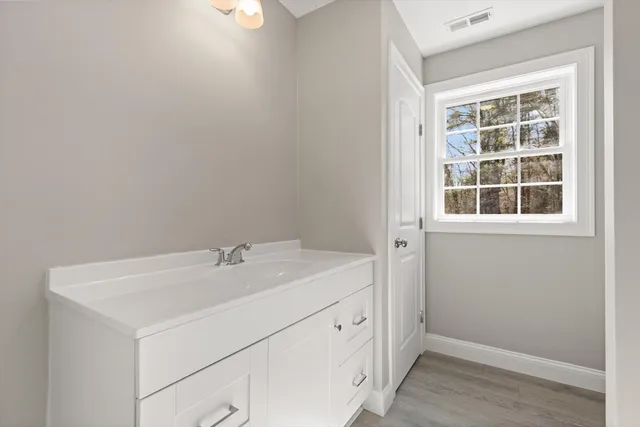 a utility room with a sink dryer and washer
