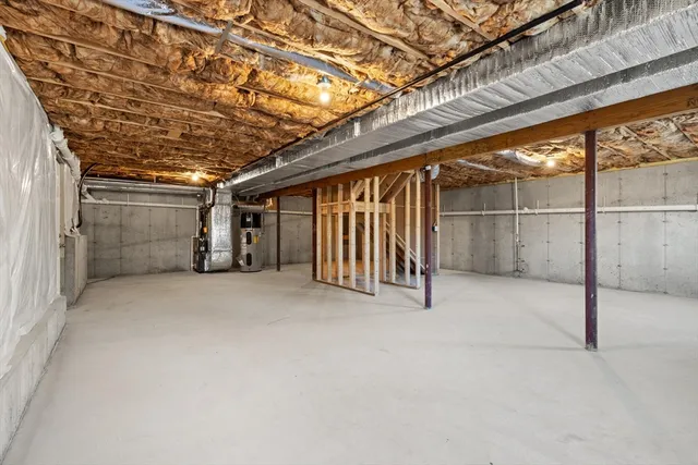 a view of empty room with white walls