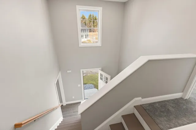 a view of entryway with stairs and wooden floor