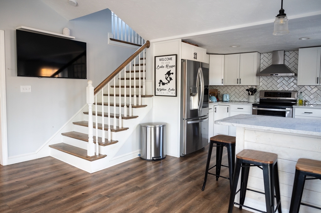 8 South Road Westminster, MA 01473 - Photo 7 of 28 a kitchen with a table chairs refrigerator and microwave