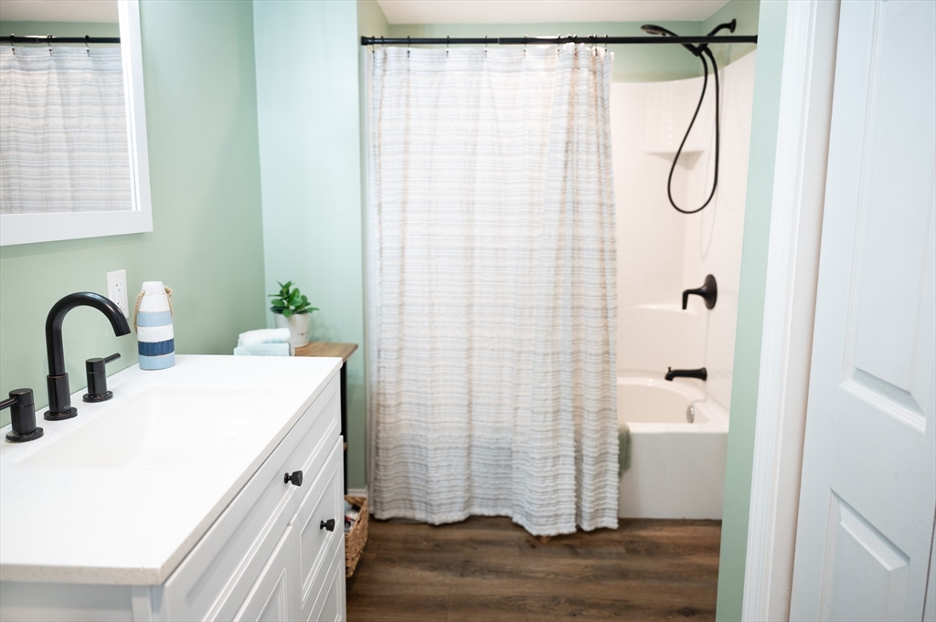 8 South Road Westminster, MA 01473 - Photo 9 of 28 a bathroom with a granite countertop sink a mirror and shower