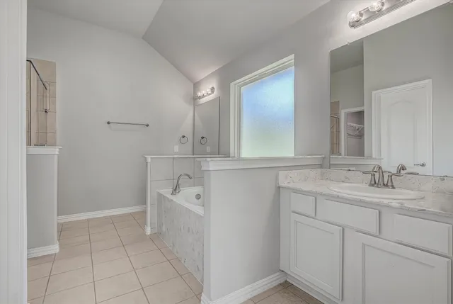 a white bath tub sitting in a bathroom
