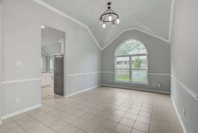 a kitchen with stainless steel appliances granite countertop a sink a stove a refrigerator and a oven