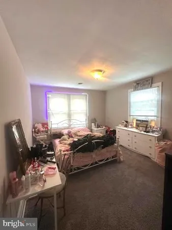 a spacious bedroom with a bed and a couch