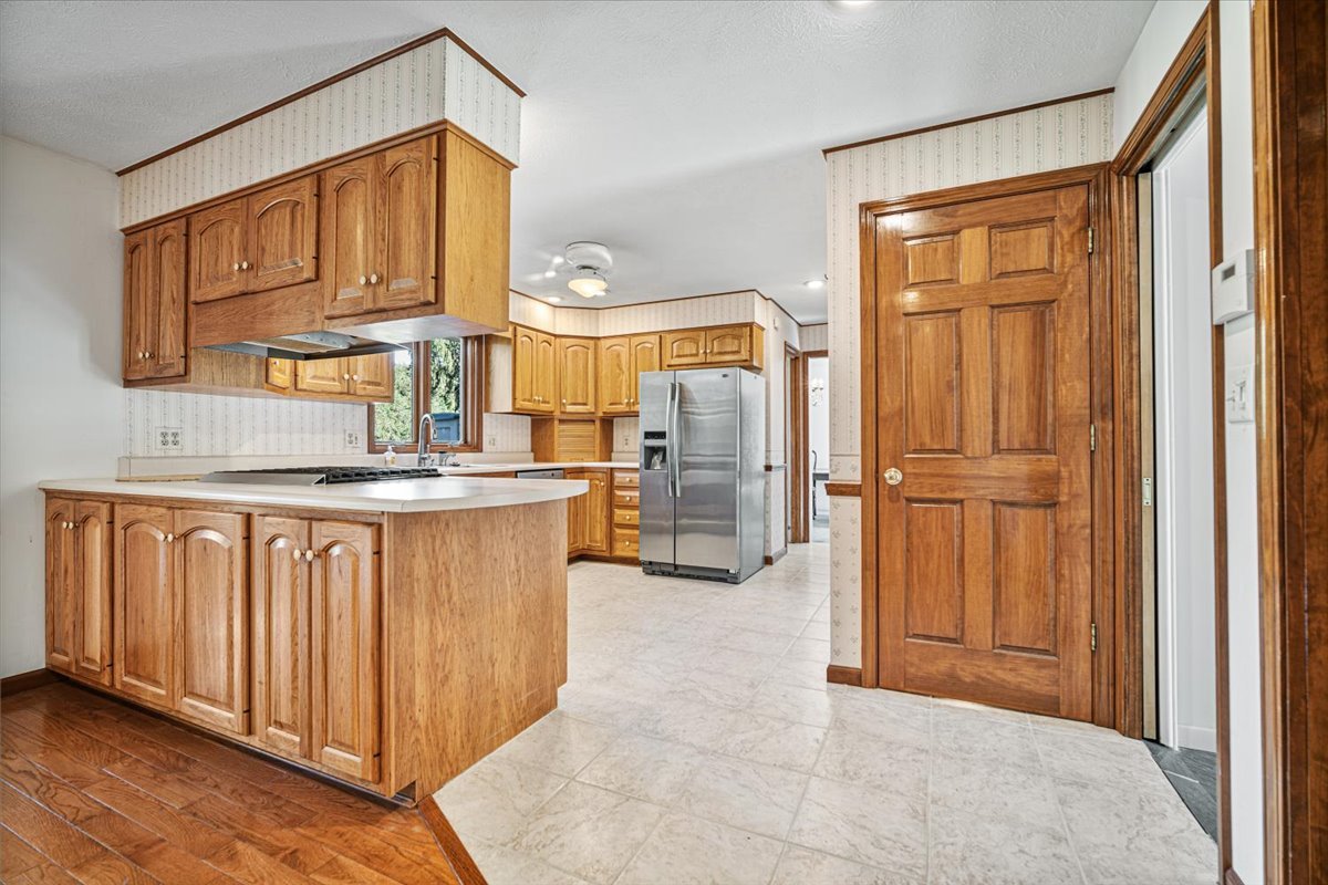 206 Imperial Drive Bloomington, IL 61701 - Photo 13 of 37 a view of kitchen with granite countertop cabinets and refrigerator