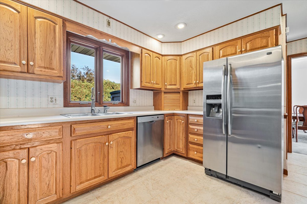 206 Imperial Drive Bloomington, IL 61701 - Photo 15 of 37 a kitchen with stainless steel appliances granite countertop a refrigerator and a sink