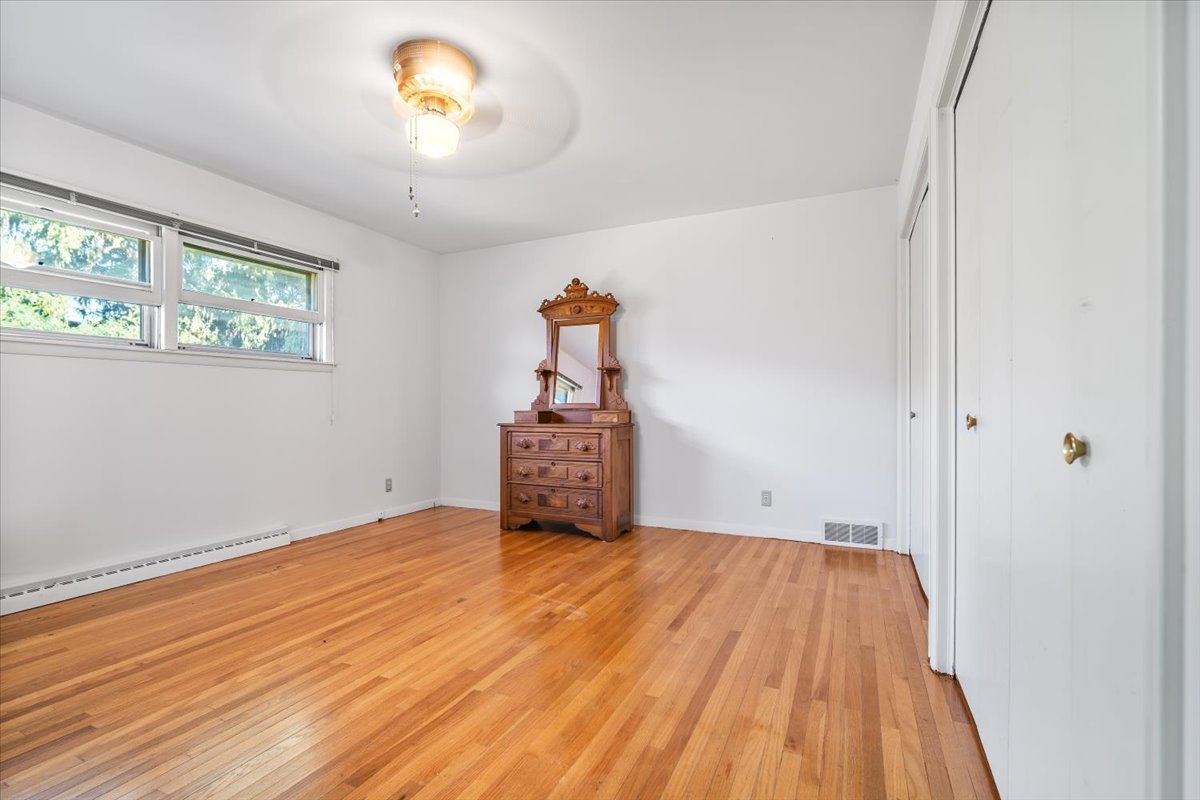 206 Imperial Drive Bloomington, IL 61701 - Photo 20 of 37 a view of a room with wooden floor and a window