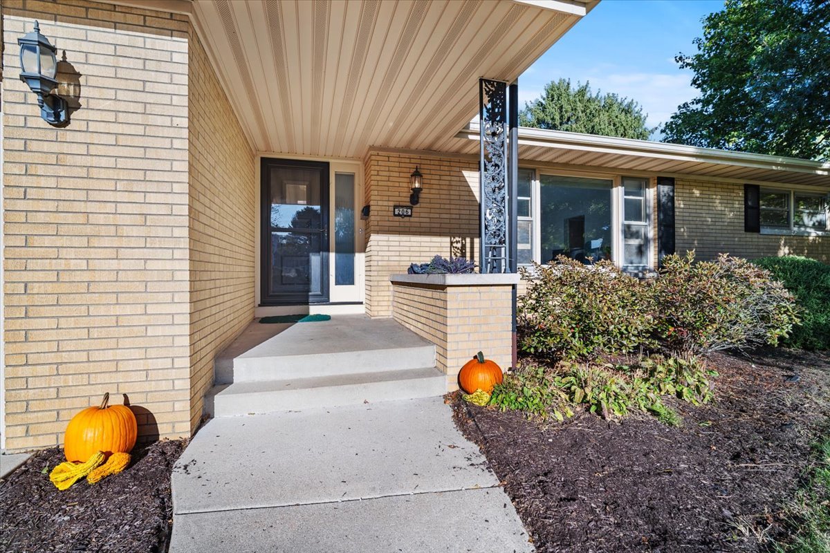 206 Imperial Drive Bloomington, IL 61701 - Photo 2 of 37 a front view of a house with garden