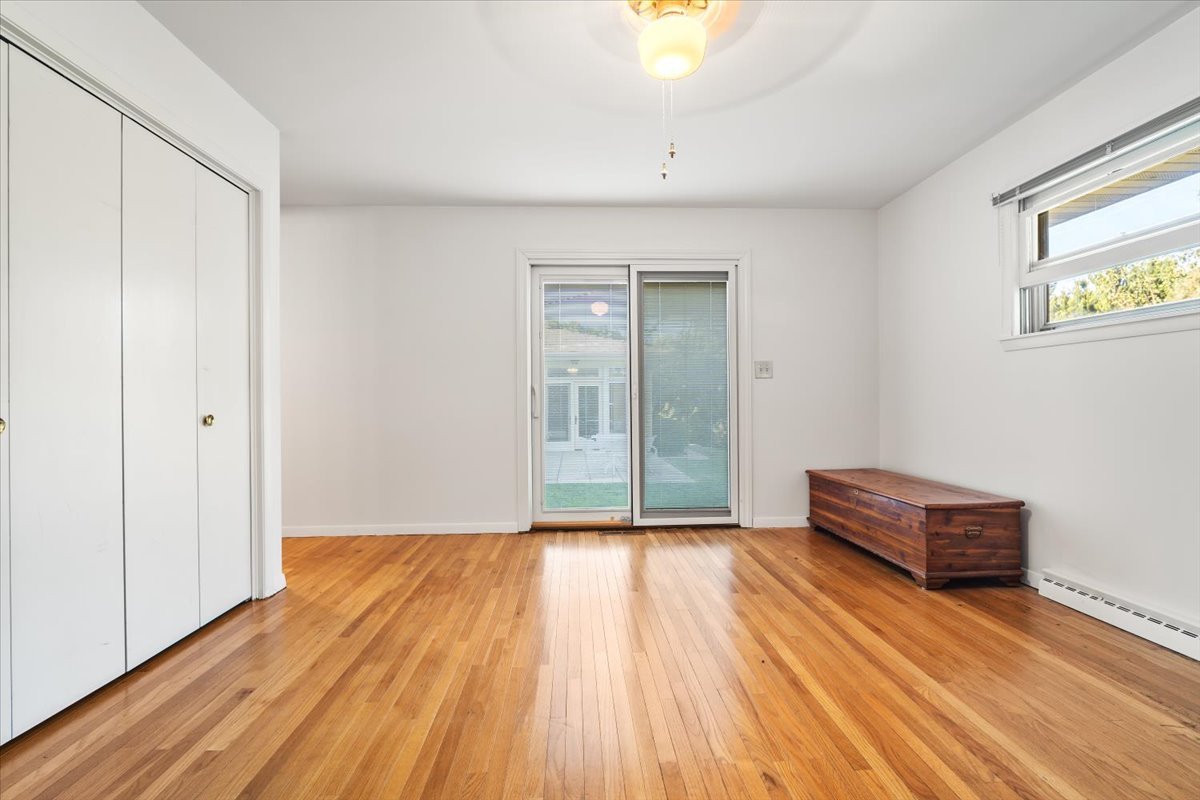 206 Imperial Drive Bloomington, IL 61701 - Photo 21 of 37 a view of an empty room with wooden floor and a window