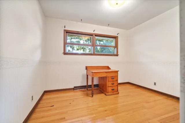 a room with a table and a window