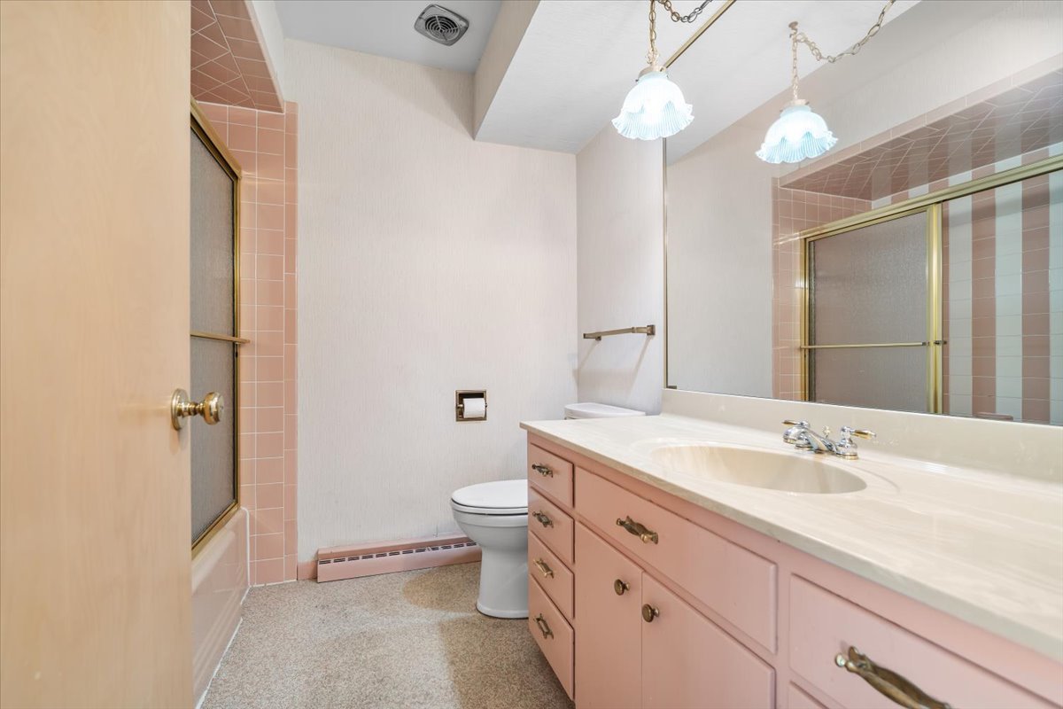 206 Imperial Drive Bloomington, IL 61701 - Photo 25 of 37 a bathroom with a sink a toilet and shower