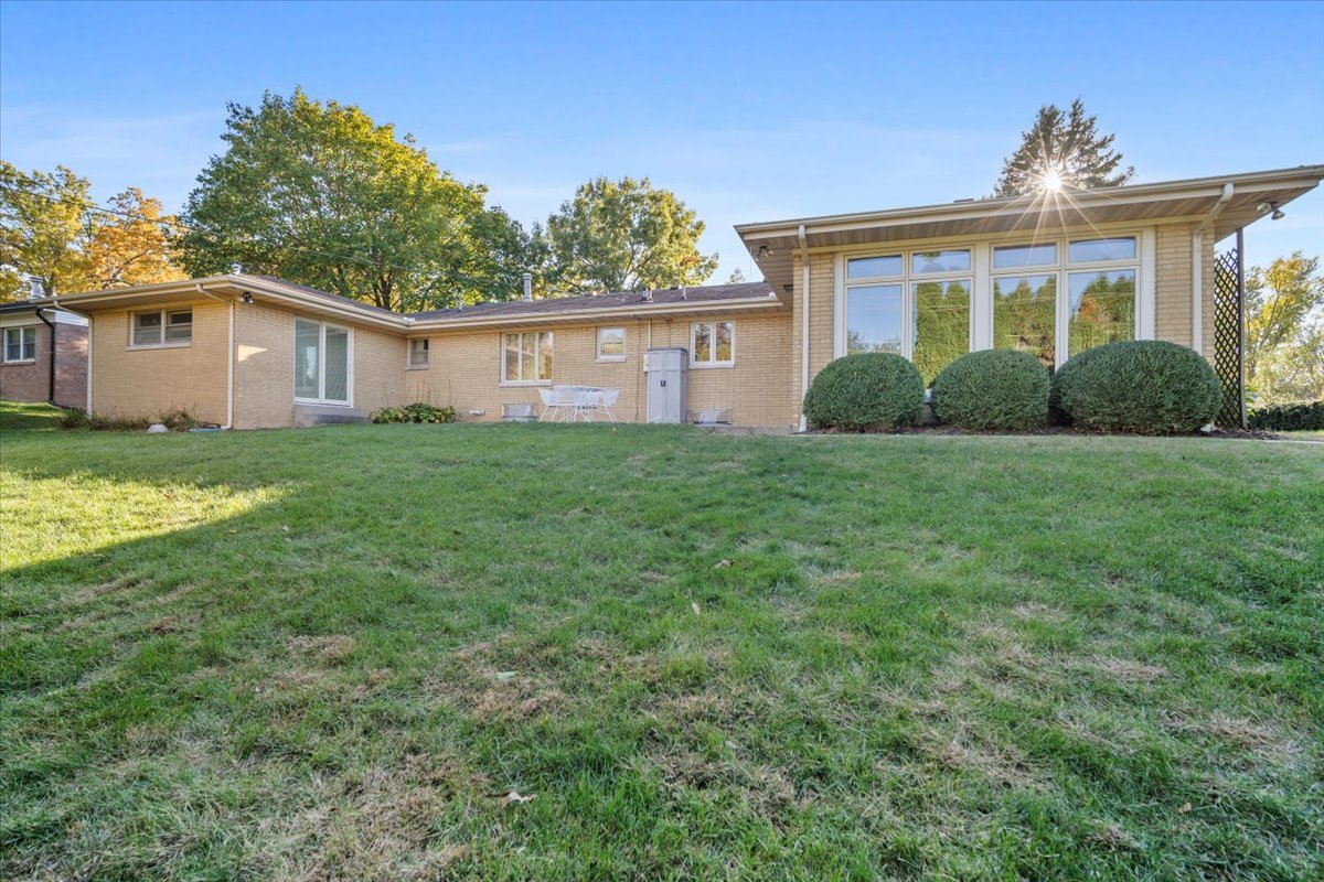 206 Imperial Drive Bloomington, IL 61701 - Photo 33 of 37 a view of a yard in front of a house with plants and large tree