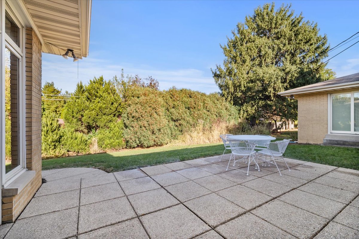 206 Imperial Drive Bloomington, IL 61701 - Photo 37 of 37 a view of a chairs and table in backyard of the house
