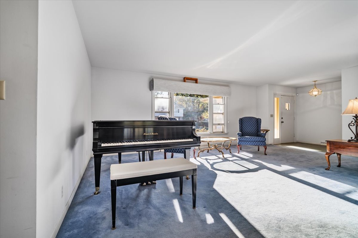 206 Imperial Drive Bloomington, IL 61701 - Photo 5 of 37 a living room with furniture a rug and a window
