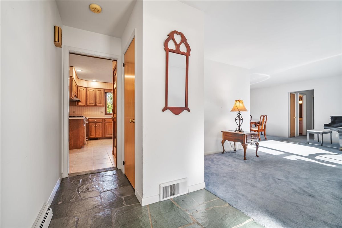 206 Imperial Drive Bloomington, IL 61701 - Photo 6 of 37 a view of a hallway with wooden floor and furniture