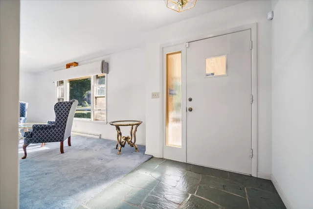 a workspace with furniture and a window