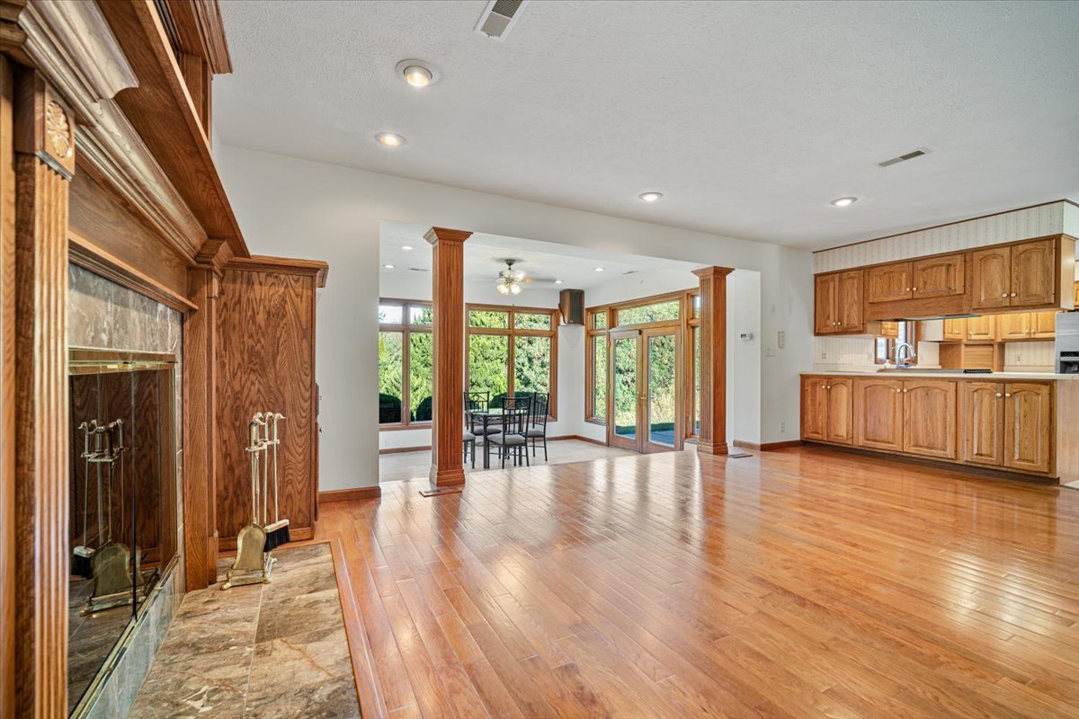 206 Imperial Drive Bloomington, IL 61701 - Photo 9 of 37 a view of empty room with wooden floor and floor to ceiling window