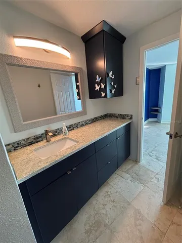 a bathroom with a sink double vanity and a mirror