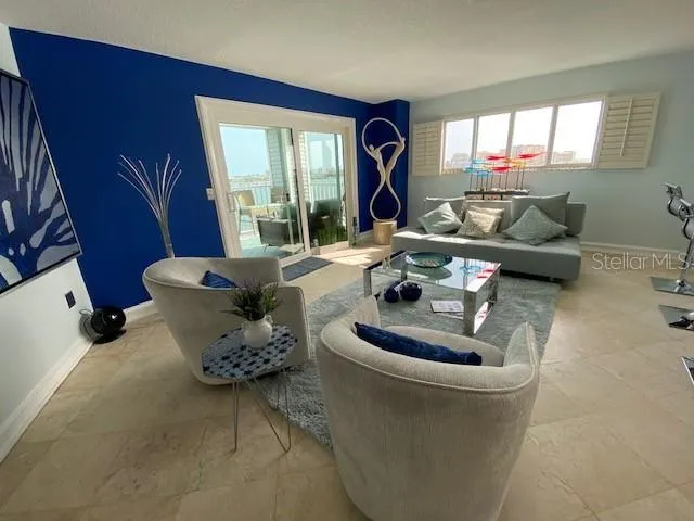 a living room with furniture and a large window