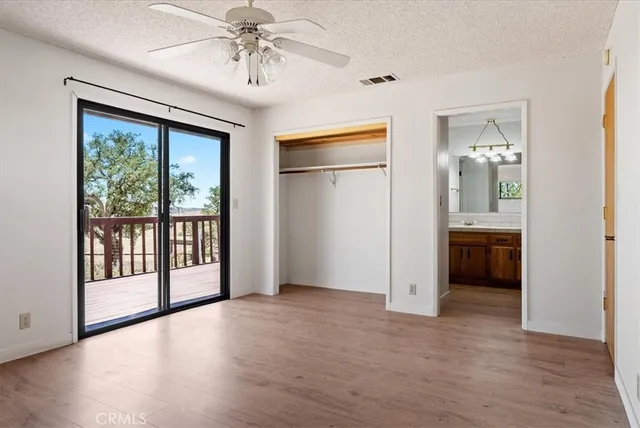 a view of hallway with wooden floor