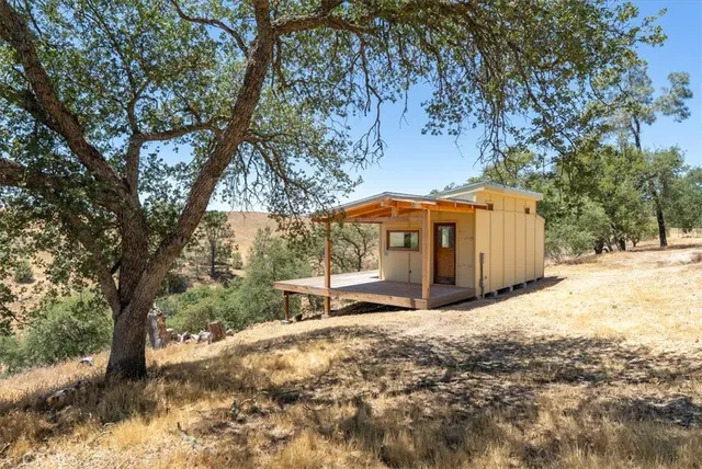a view of a balcony with wooden floor and city view