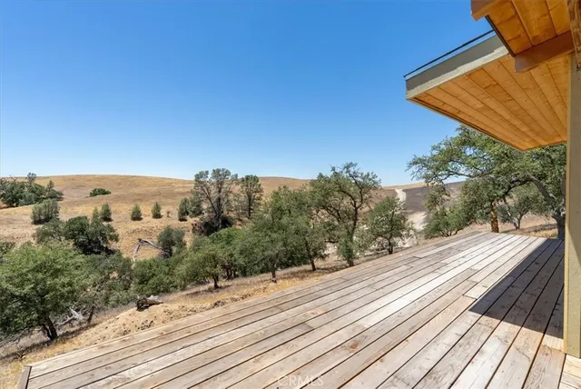 a view of a house with swimming pool and sitting area
