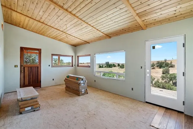 a view of balcony with wooden floor and outdoor seating