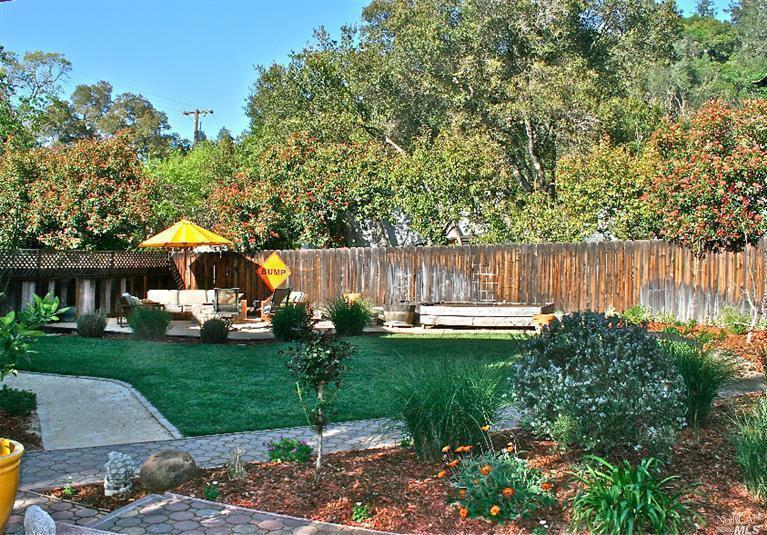 The large private backyard has lots of room for entertaining and relaxing.