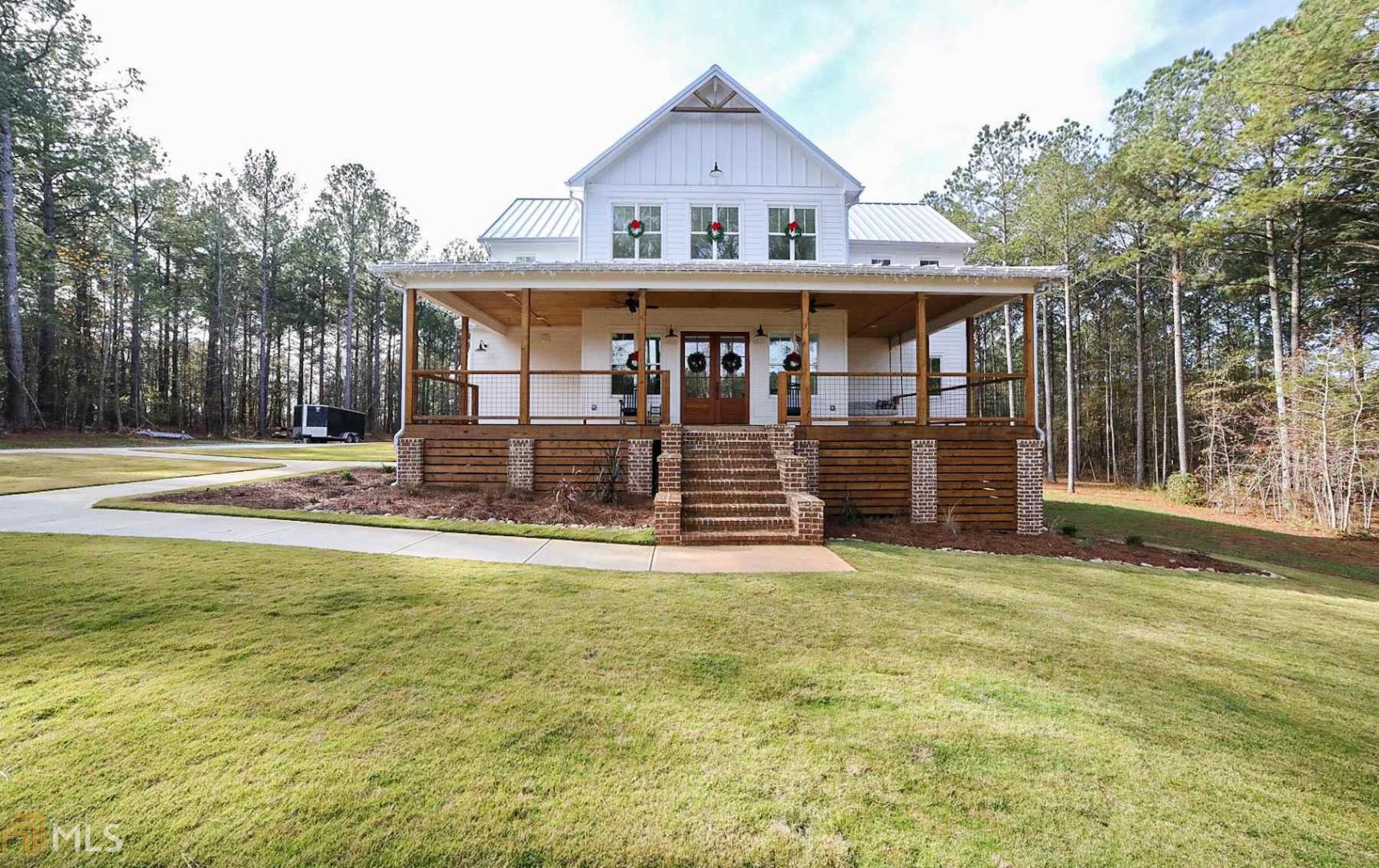 1571 Riverwalk Road Bishop, GA 30621 - Photo 1 of 1 a view of a house with a big yard and large tree