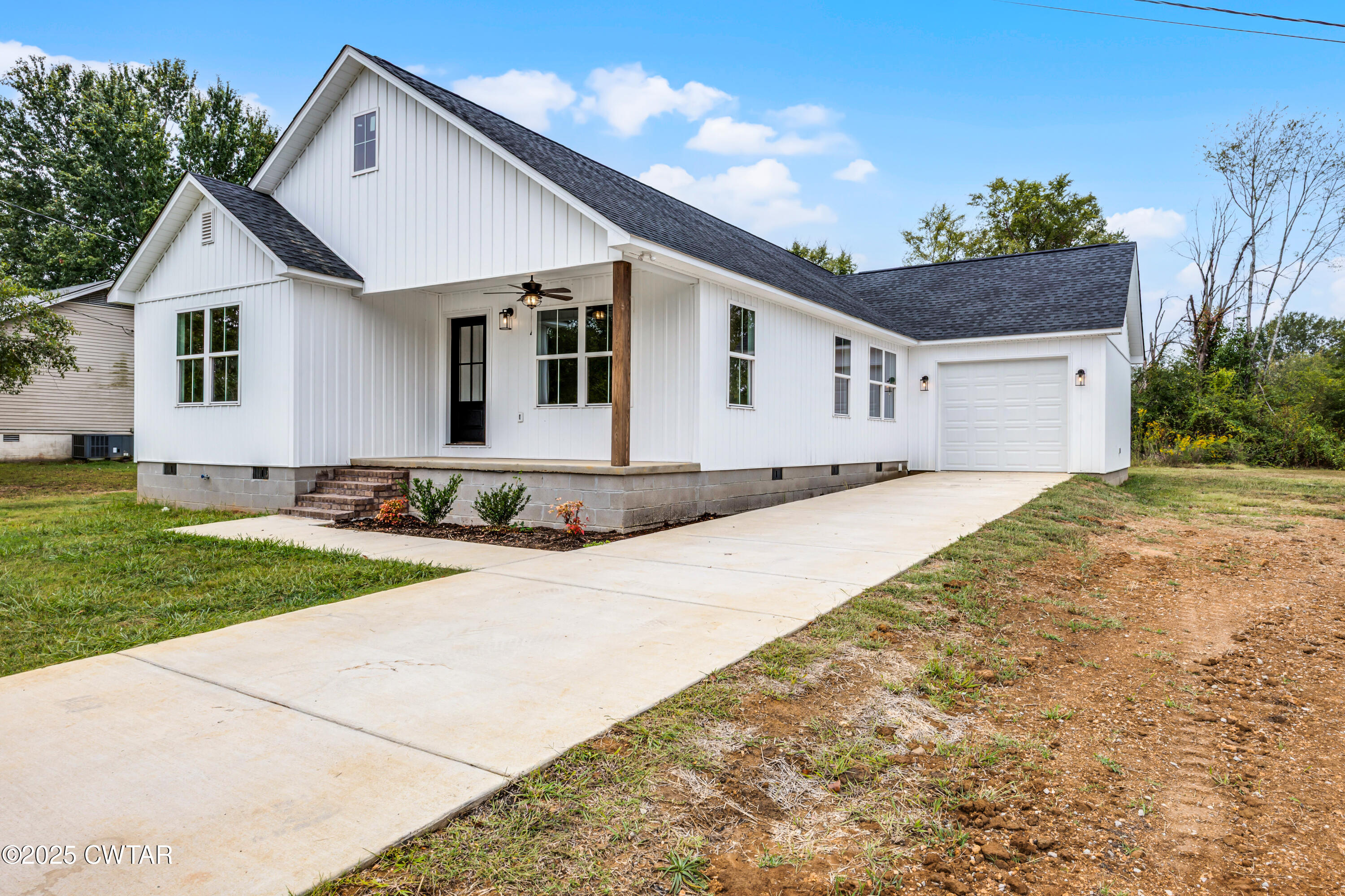 757 Christi Loop Henderson, TN 38340 - Photo 21 of 21 a front view of a house with a garden and yard