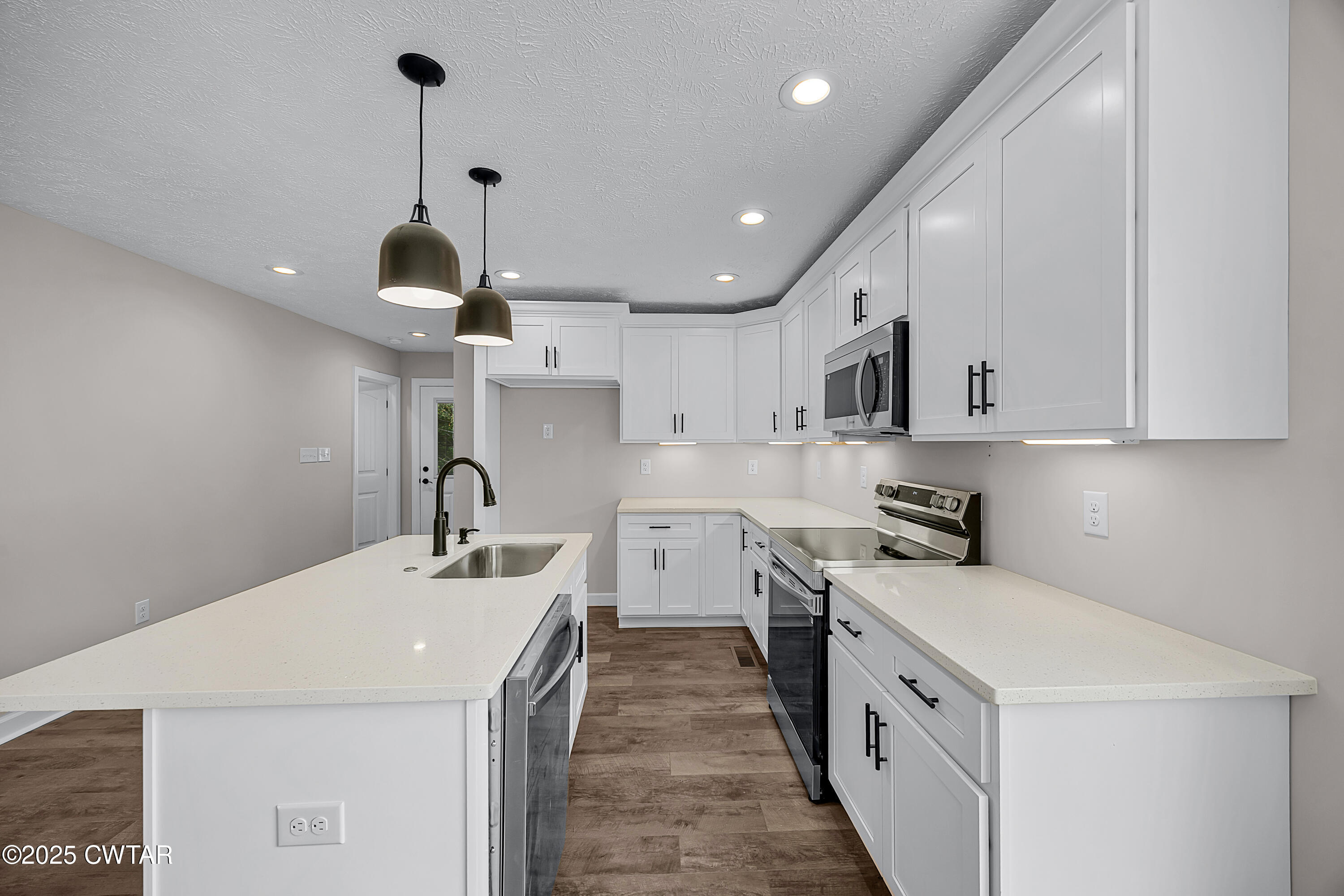 757 Christi Loop Henderson, TN 38340 - Photo 4 of 21 a kitchen with stainless steel appliances a sink stove and refrigerator