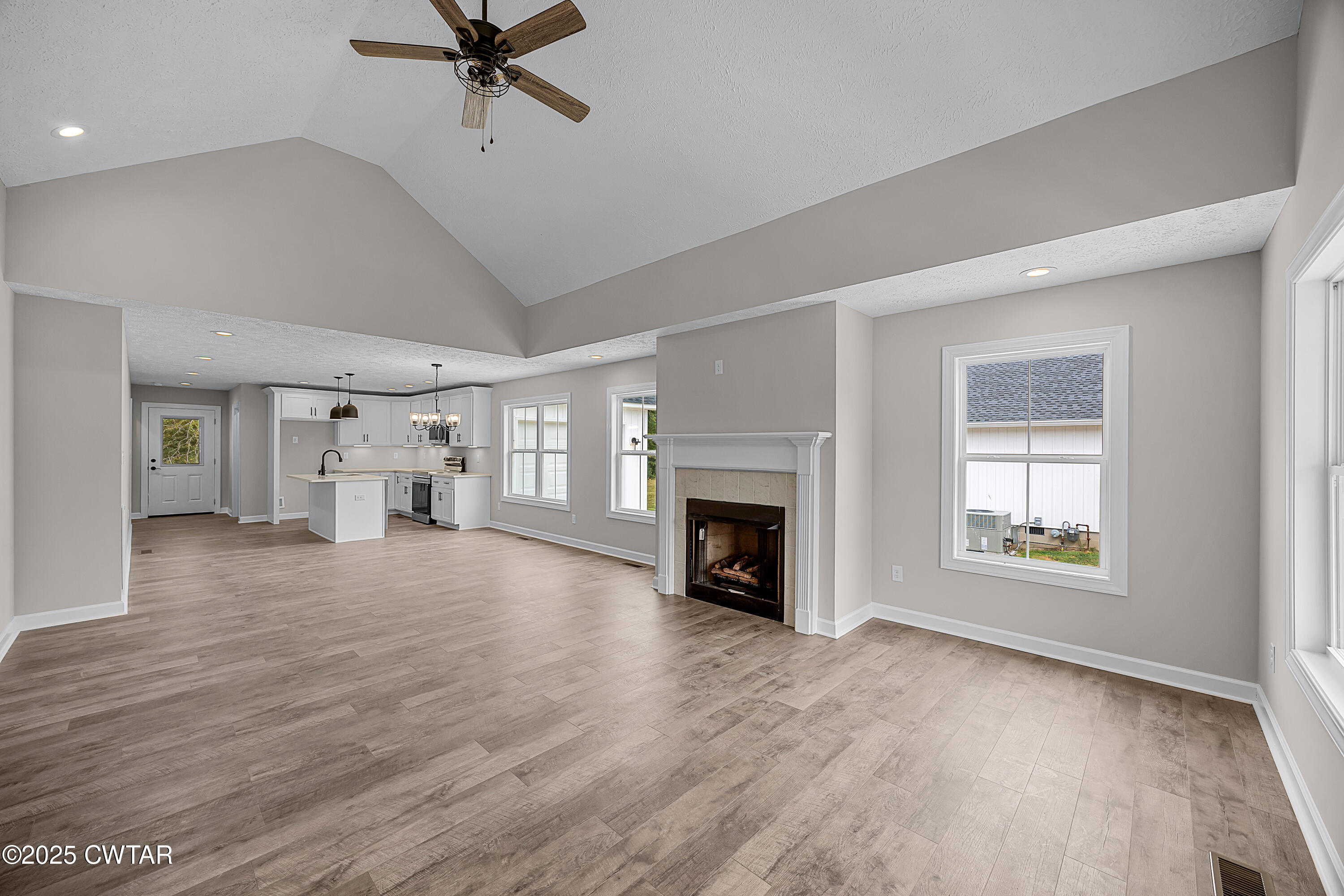 757 Christi Loop Henderson, TN 38340 - Photo 8 of 21 a view of empty room with a fireplace and wooden floor