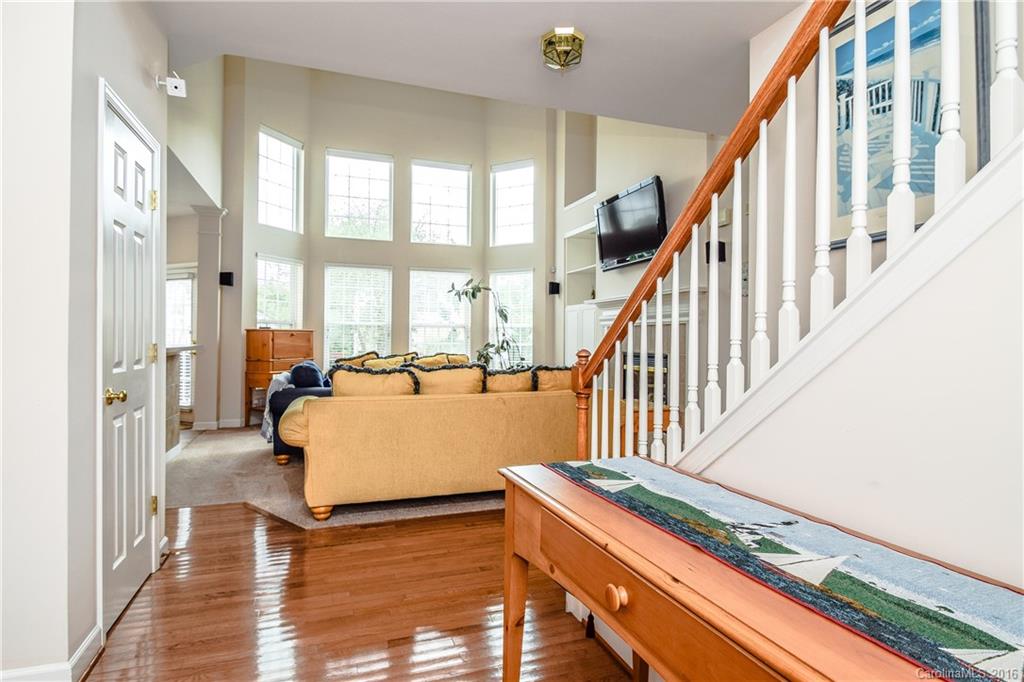 15739 Trenton Place Road Huntersville, NC 28078 - Photo 2 of 16 a living room with wooden floor and a large window
