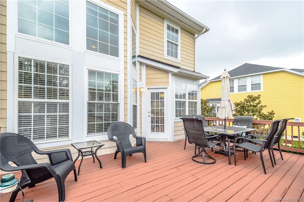 15739 Trenton Place Road Huntersville, NC 28078 - Photo 11 of 16 a view of a dinning table and chairs in the patio