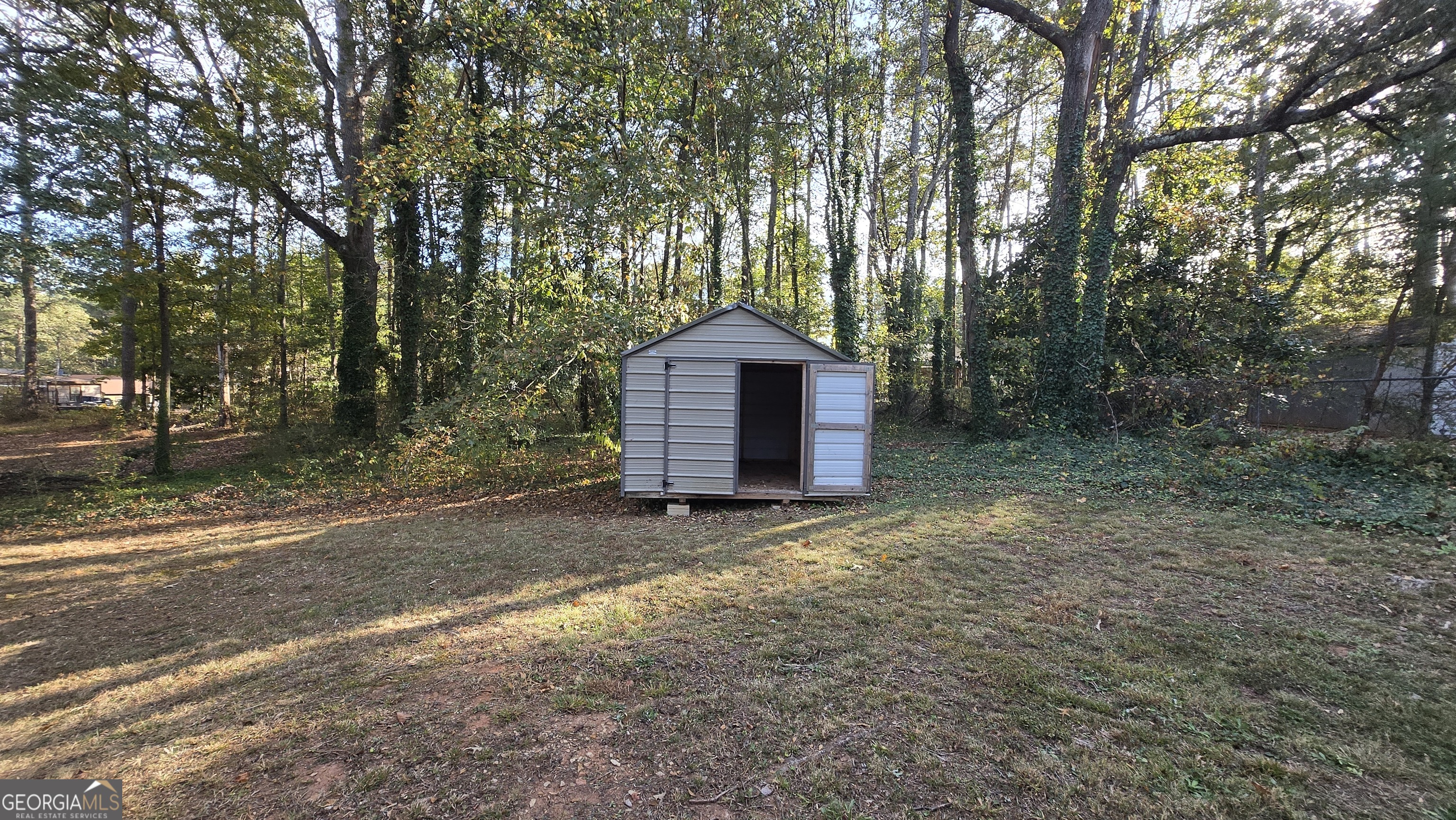 2416 Newgate Drive Decatur, GA 30035 - Photo 4 of 16 a view of a small yard with large trees