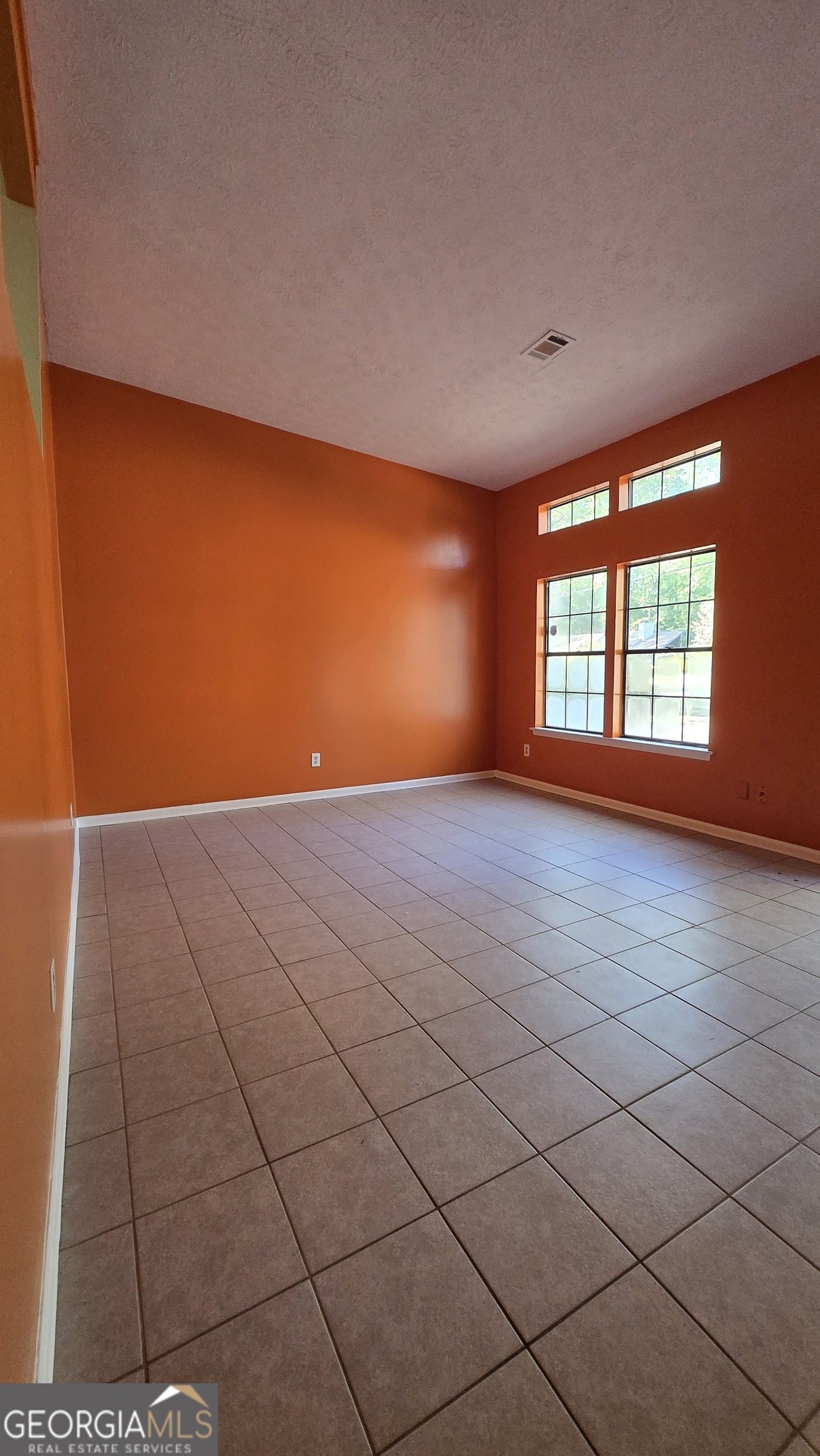 2416 Newgate Drive Decatur, GA 30035 - Photo 7 of 16 a view of an empty room with a window