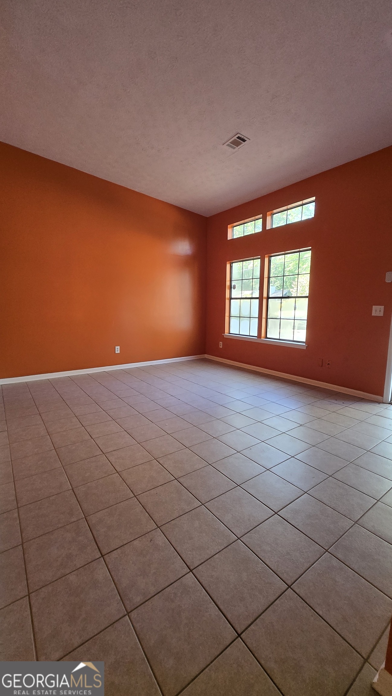 2416 Newgate Drive Decatur, GA 30035 - Photo 8 of 16 a view of an empty room with a window
