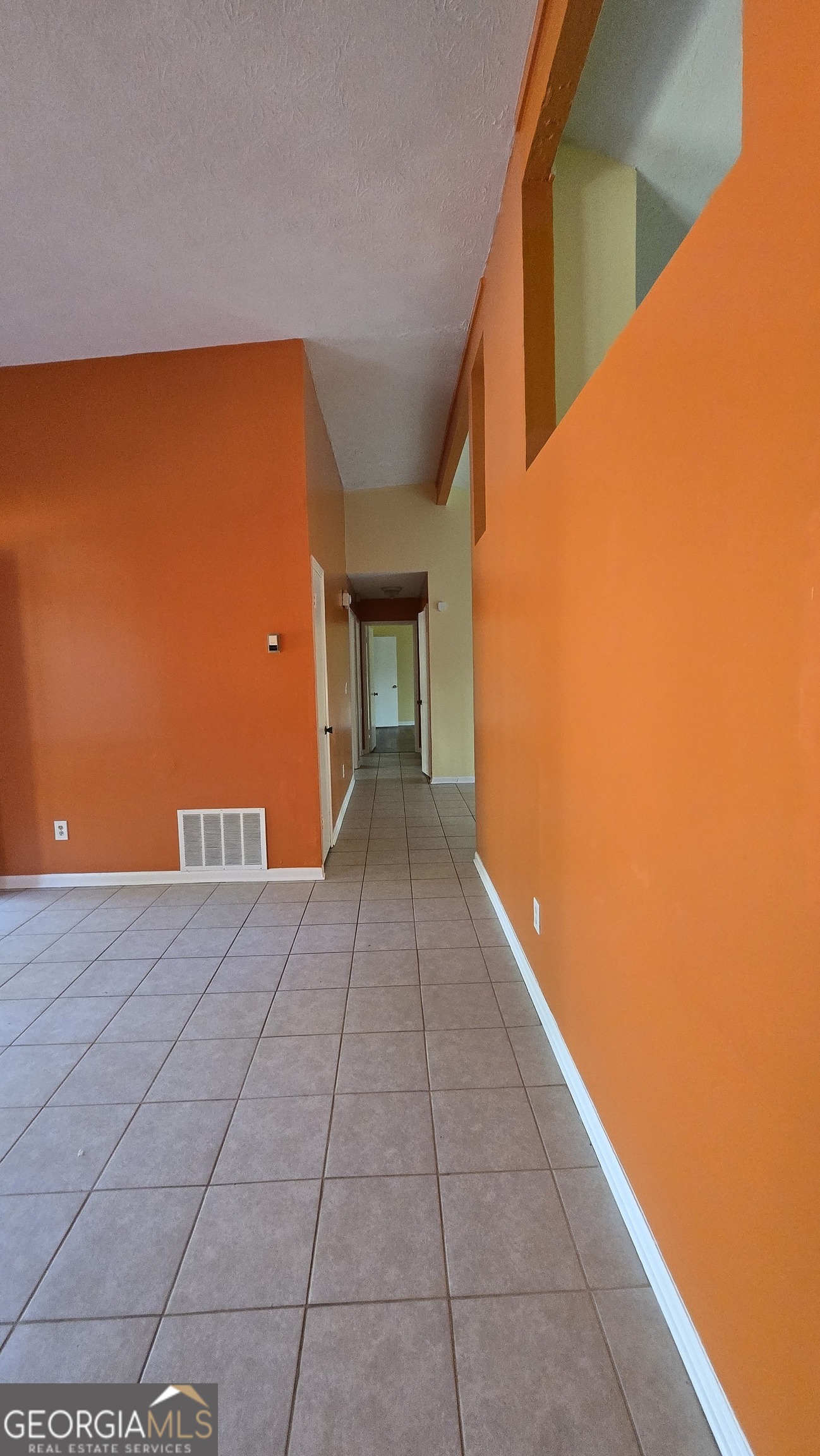 2416 Newgate Drive Decatur, GA 30035 - Photo 9 of 16 a view of a big room with wooden floor