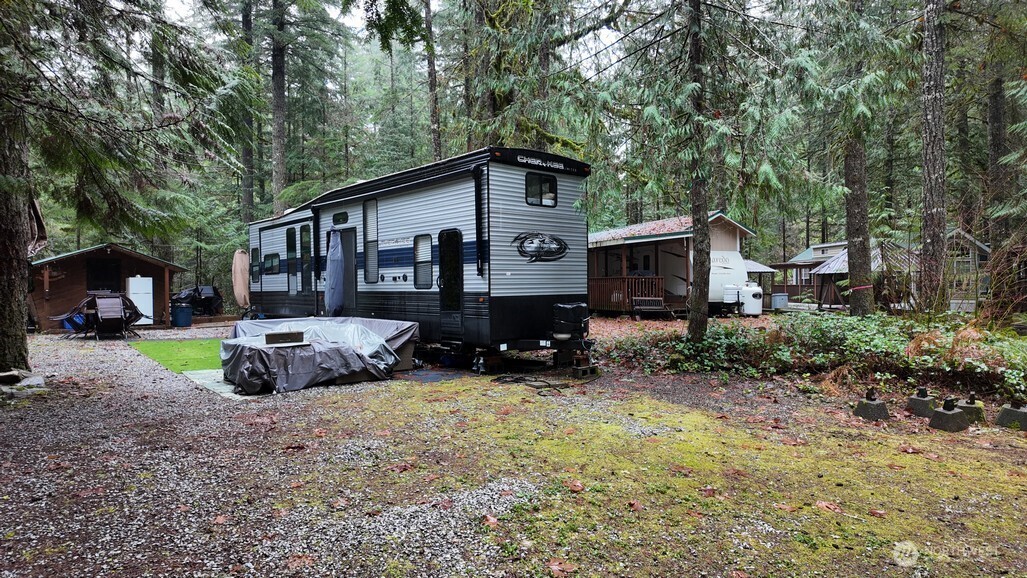 134 Jasper Trail Deming, WA 98244 - Photo 1 of 20 a front view of a house with a yard and trees