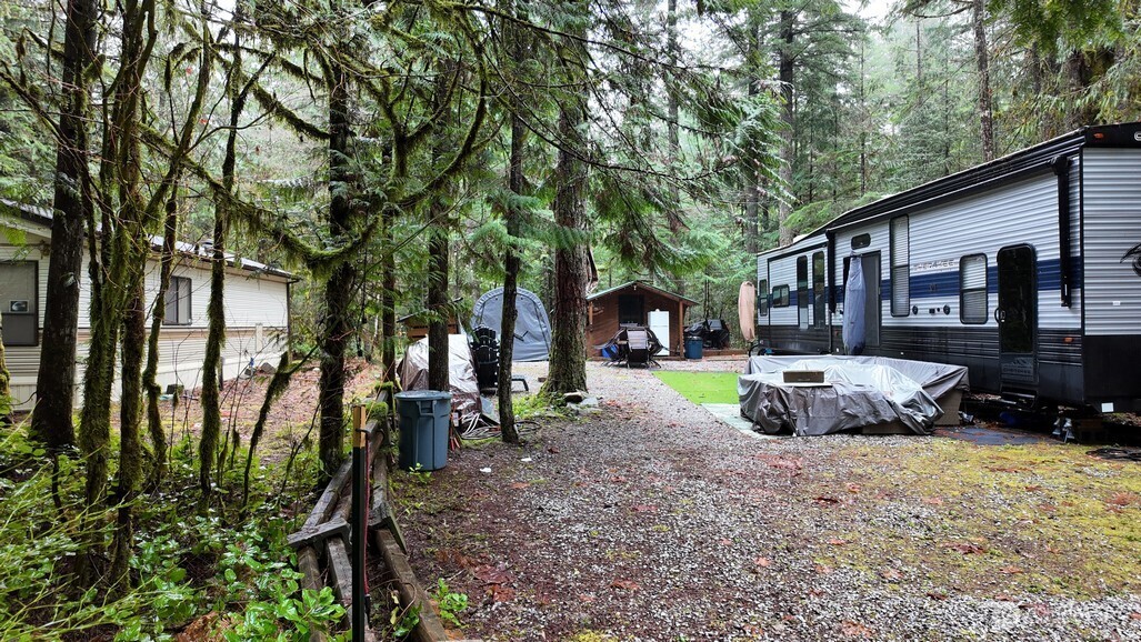 134 Jasper Trail Deming, WA 98244 - Photo 15 of 20 a view of a house with backyard and sitting area