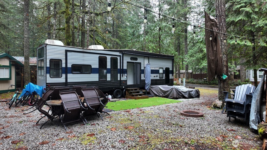 134 Jasper Trail Deming, WA 98244 - Photo 18 of 20 a view of a house with backyard and sitting area