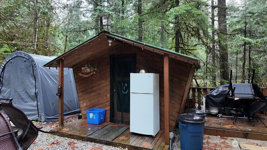 134 Jasper Trail Deming, WA 98244 - Photo 4 of 20 a backyard of a house with seating space