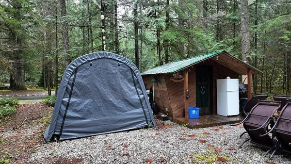 a backyard of a house with barbeque oven