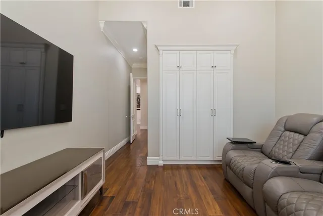 a room with furniture and a wooden floor