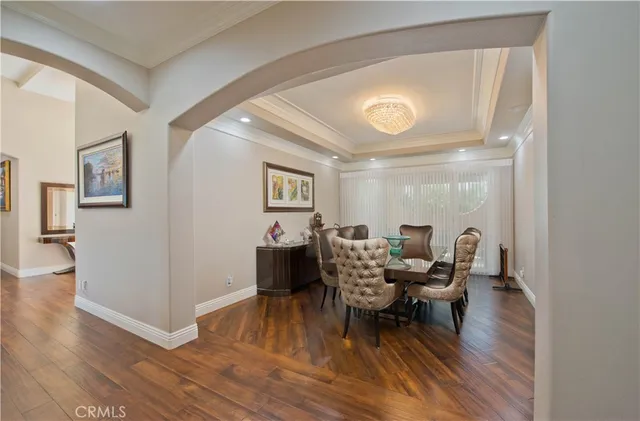 a spacious bedroom with a bed and a flat screen television