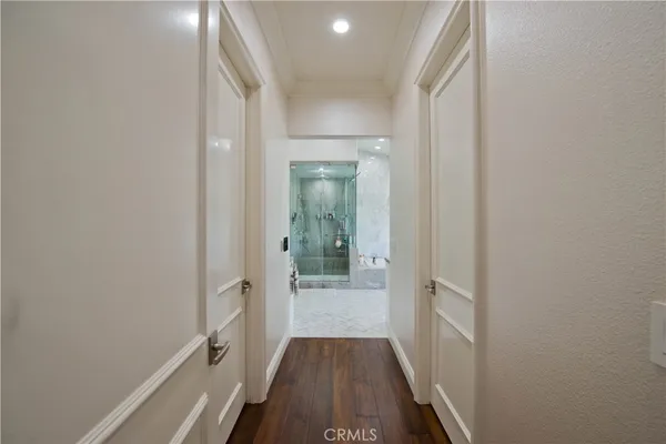 a bedroom with a bed and a flat screen television