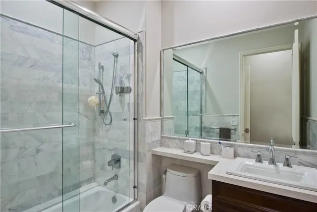 a bathroom with a toilet and shower