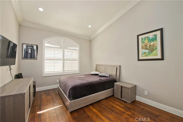 a bathroom with a granite countertop toilet sink and mirror
